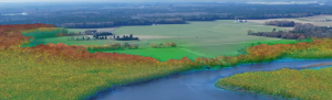 Screenshot from Jeff Allenby's powerpoint presentation showing a river and surrounding green land.